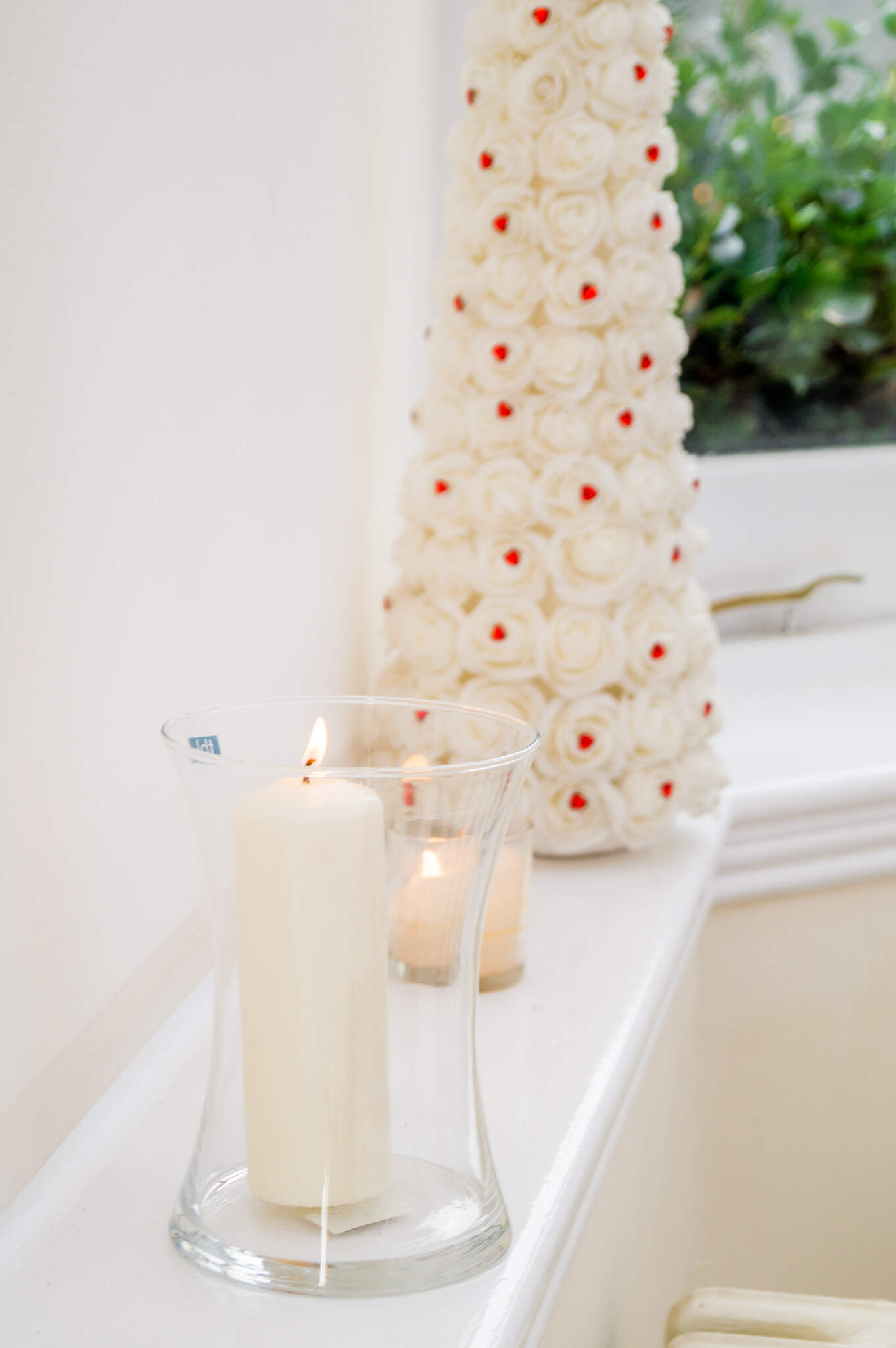 Hanbury Manor Wedding, Hertfordshire, wedding detail candles, white roses, red heart details