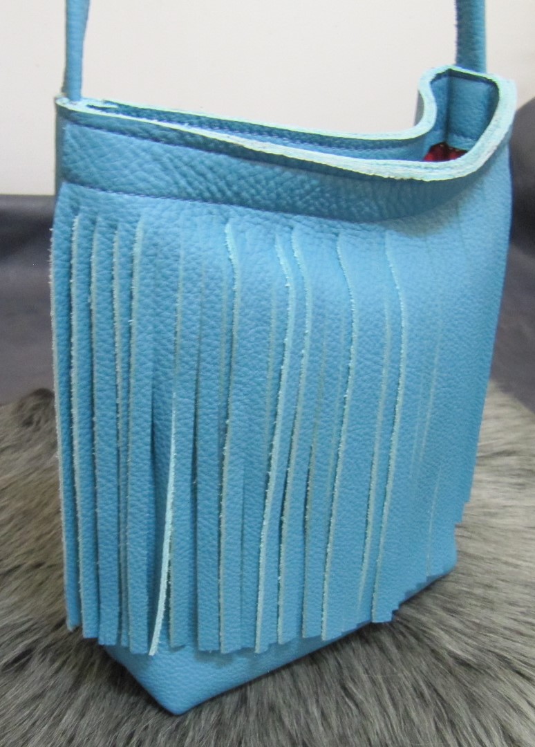 Small fringed turquoise leather bag