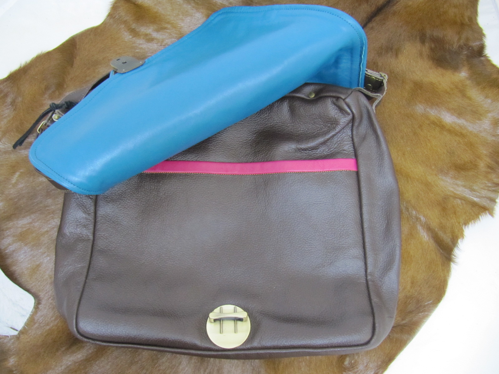 Large brown leather handbag with colourful piping