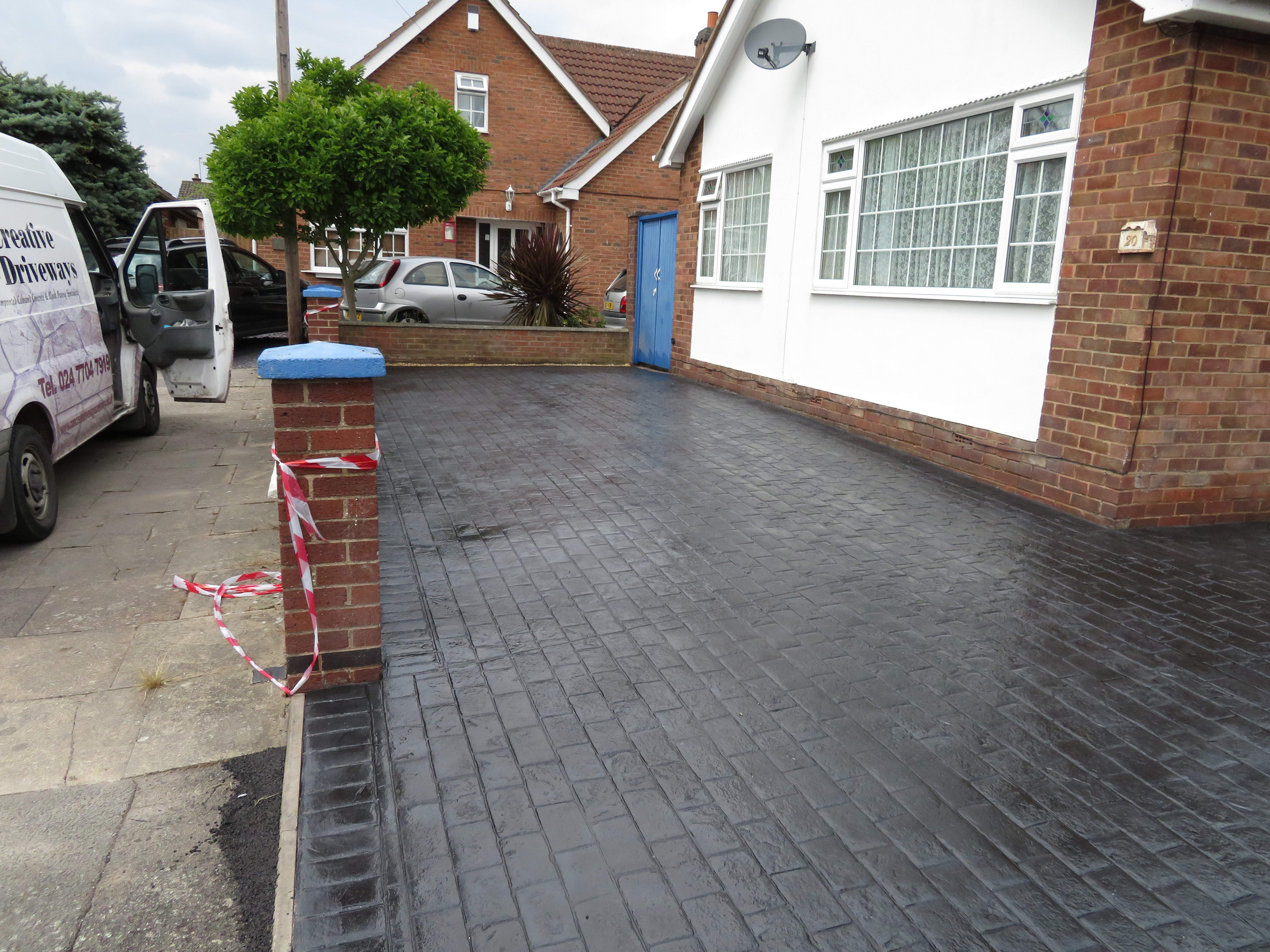 Pattern Imprinted Concrete Driveway done in a Textured Cobble Pattern