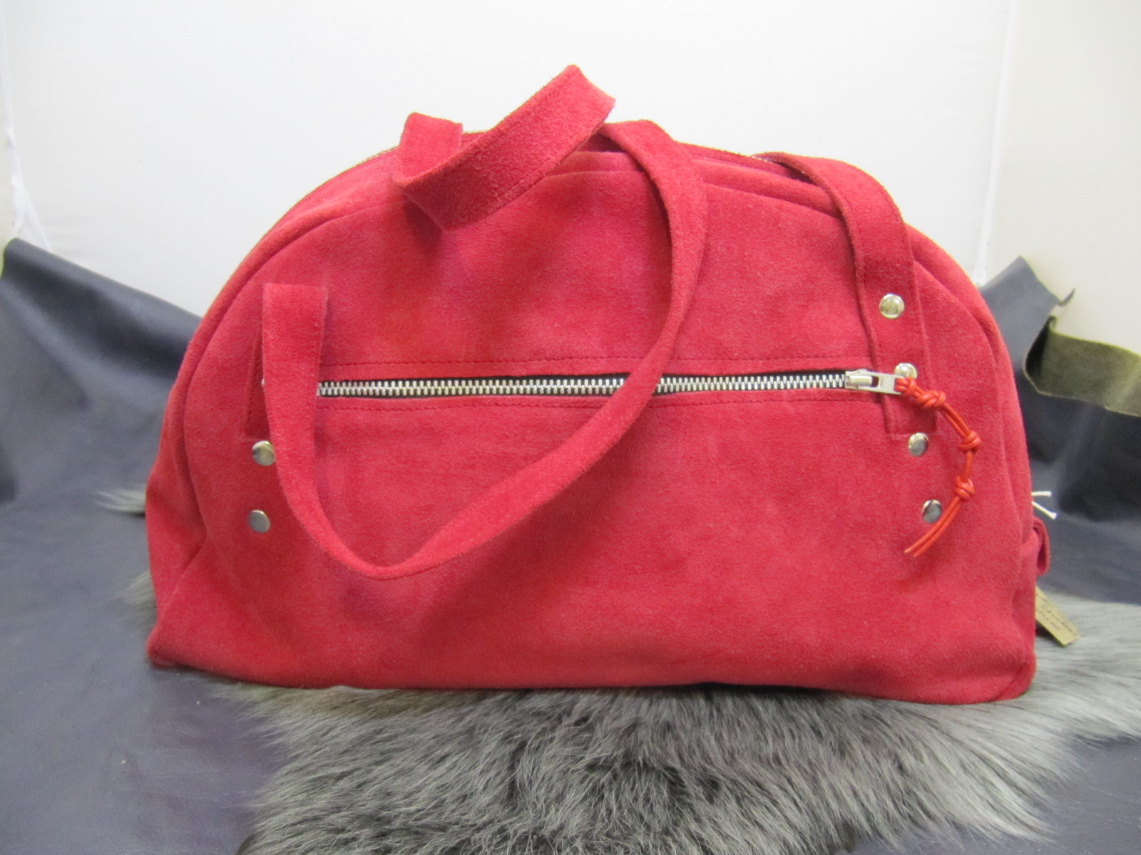 Red suede half moon handbag