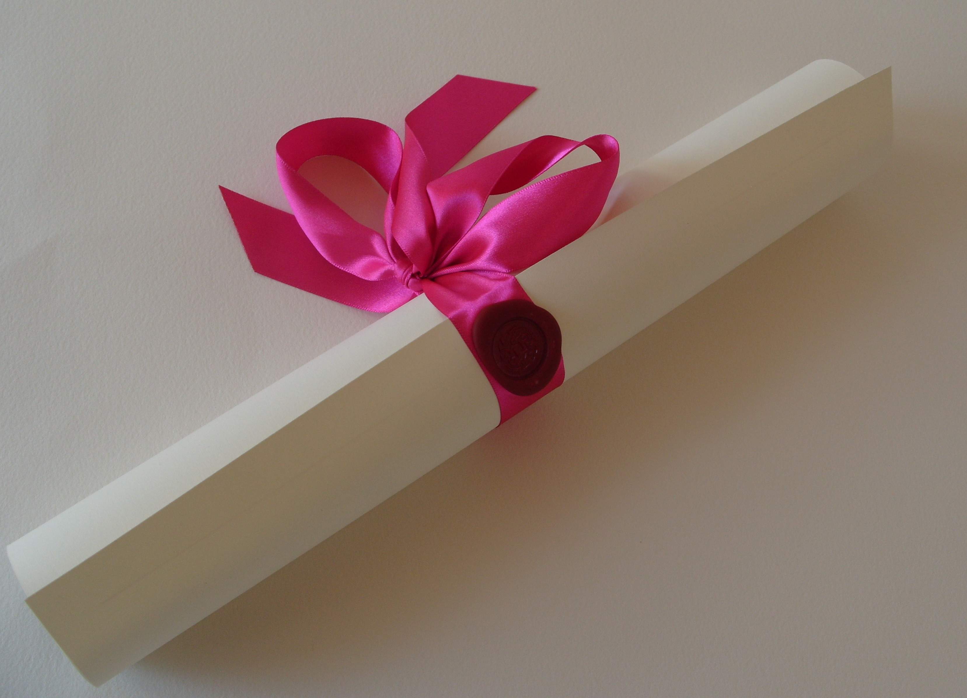 Prepared as a rolled scroll and bound with a ribbon and wax seal. A gift or special presentation.