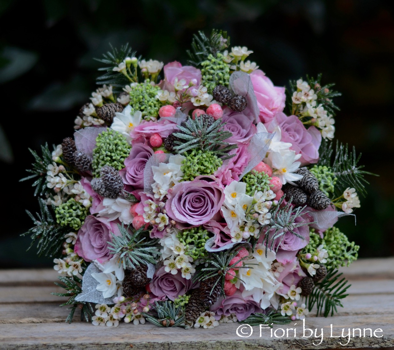 Winter bouquet with rose,pine.fir-cones,skimmia, berry,waxflower+snow.jpg