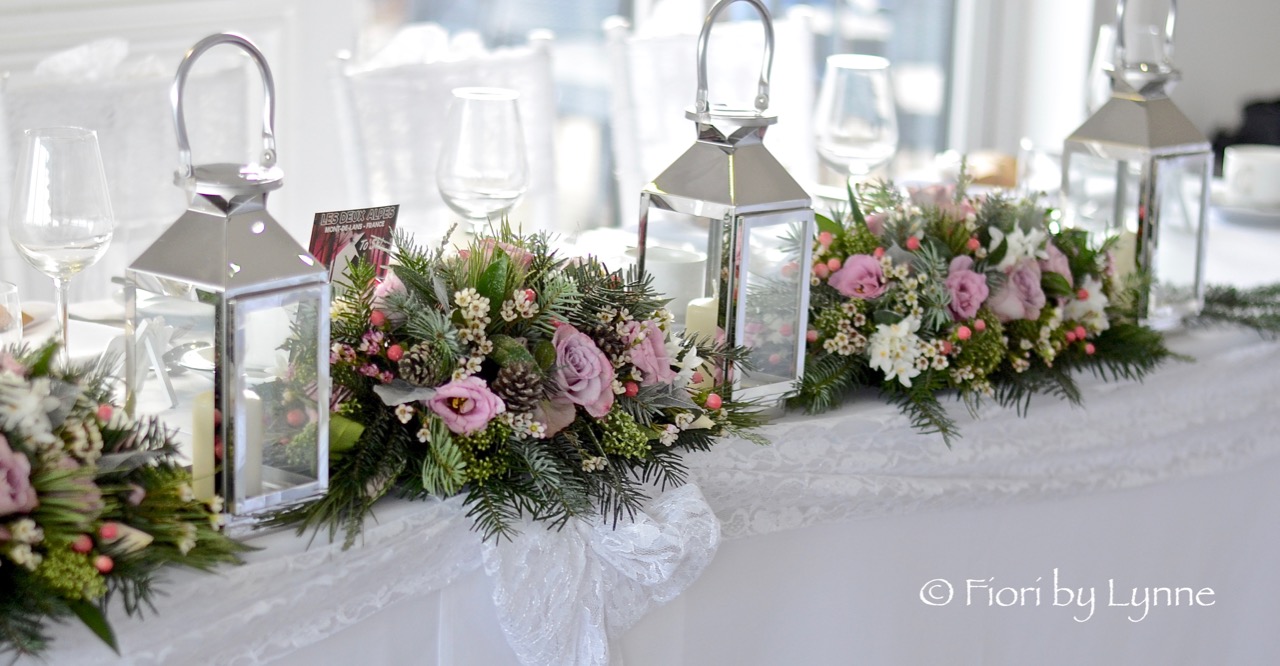 toptable-flowers-with-lanterns,Christmas-winter-wedding.jpg
