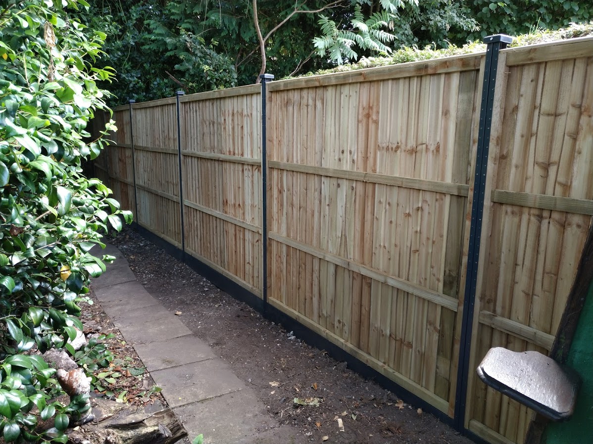 Anthracite grey steel posts on composite gravel boards.