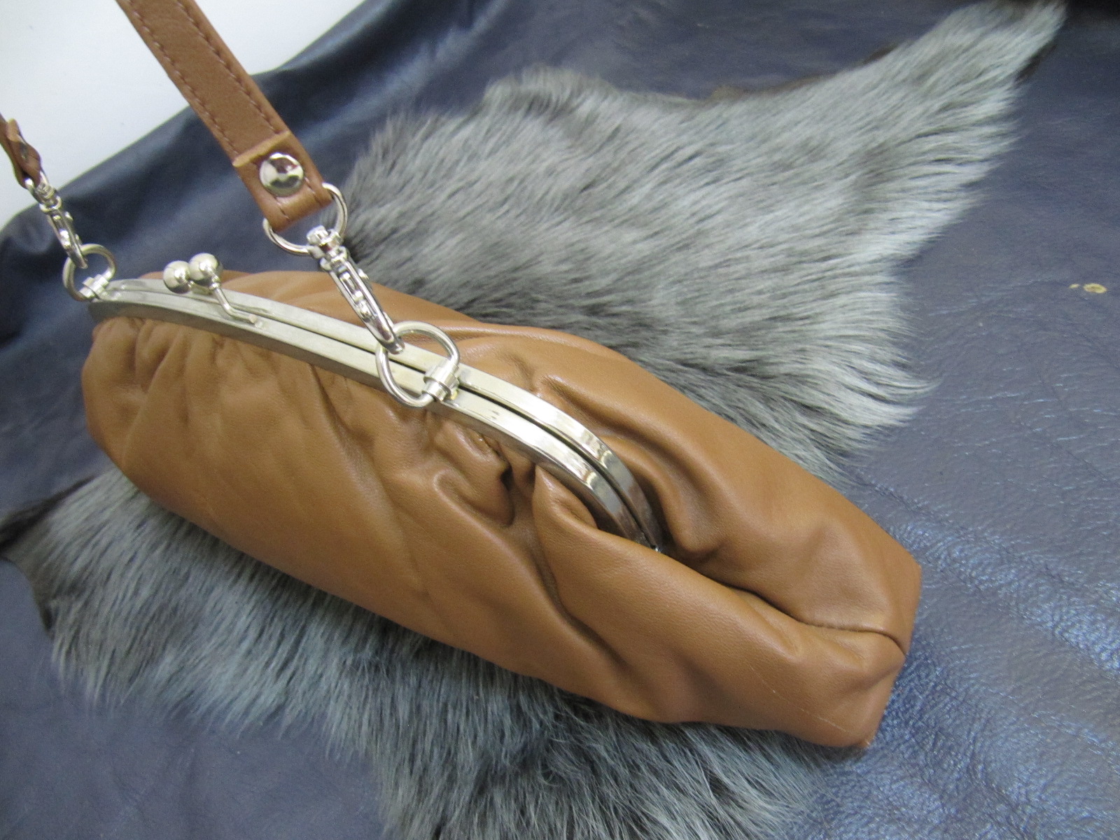 Tan leather & silver clasp top bag