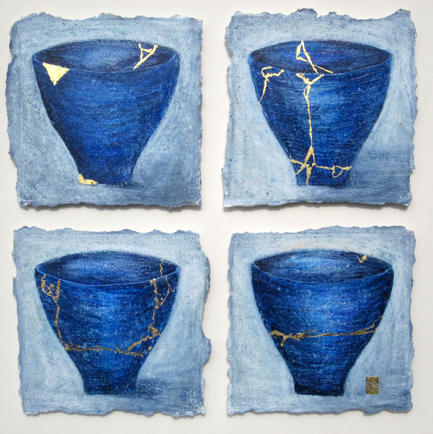 Four blue kintsugi tea bowls with gold repair