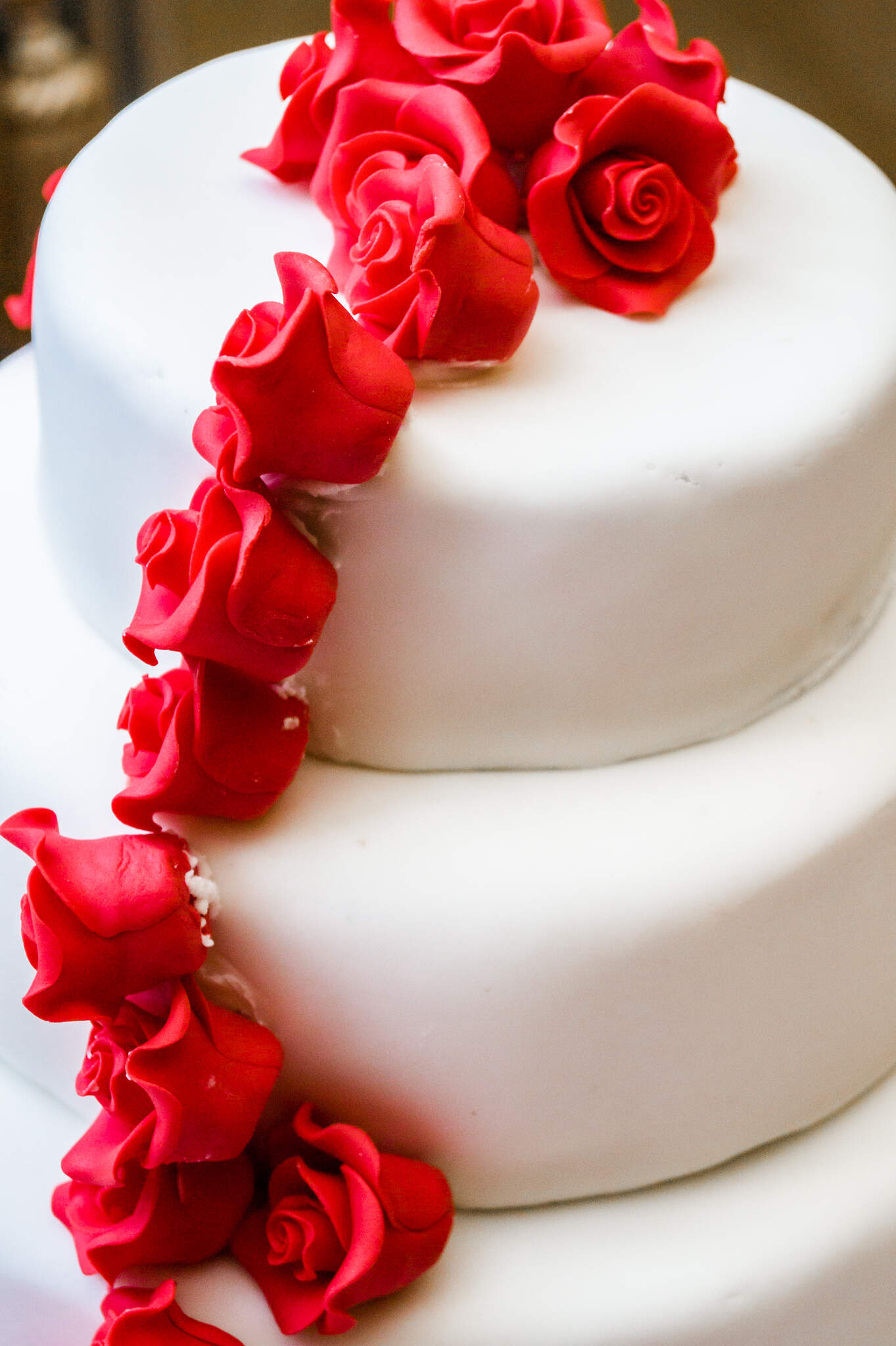Hanbury Manor Wedding, Hertfordshire, wedding cake, red fondant roses