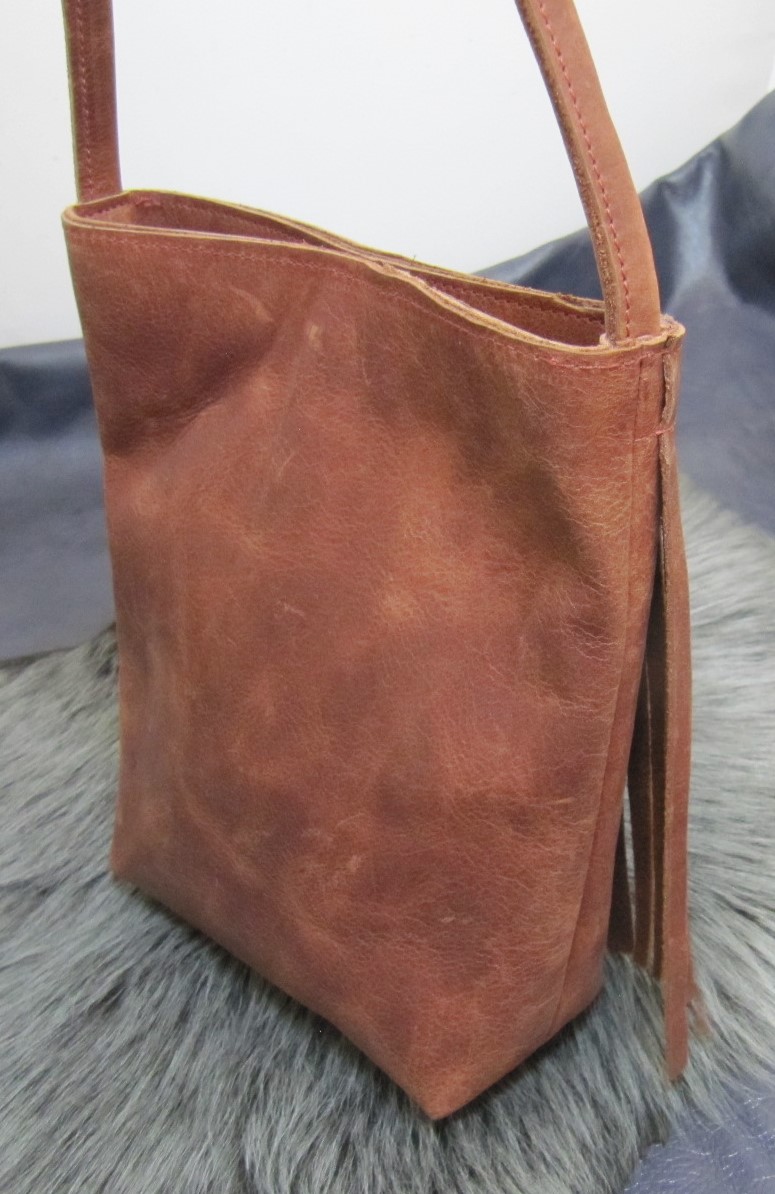 Small fringed vintage rust leather bag