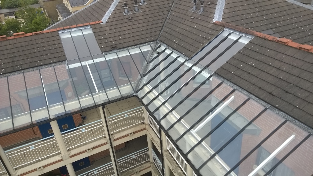 High level glass canopy clean in Cambridge - accessed by cherry picker