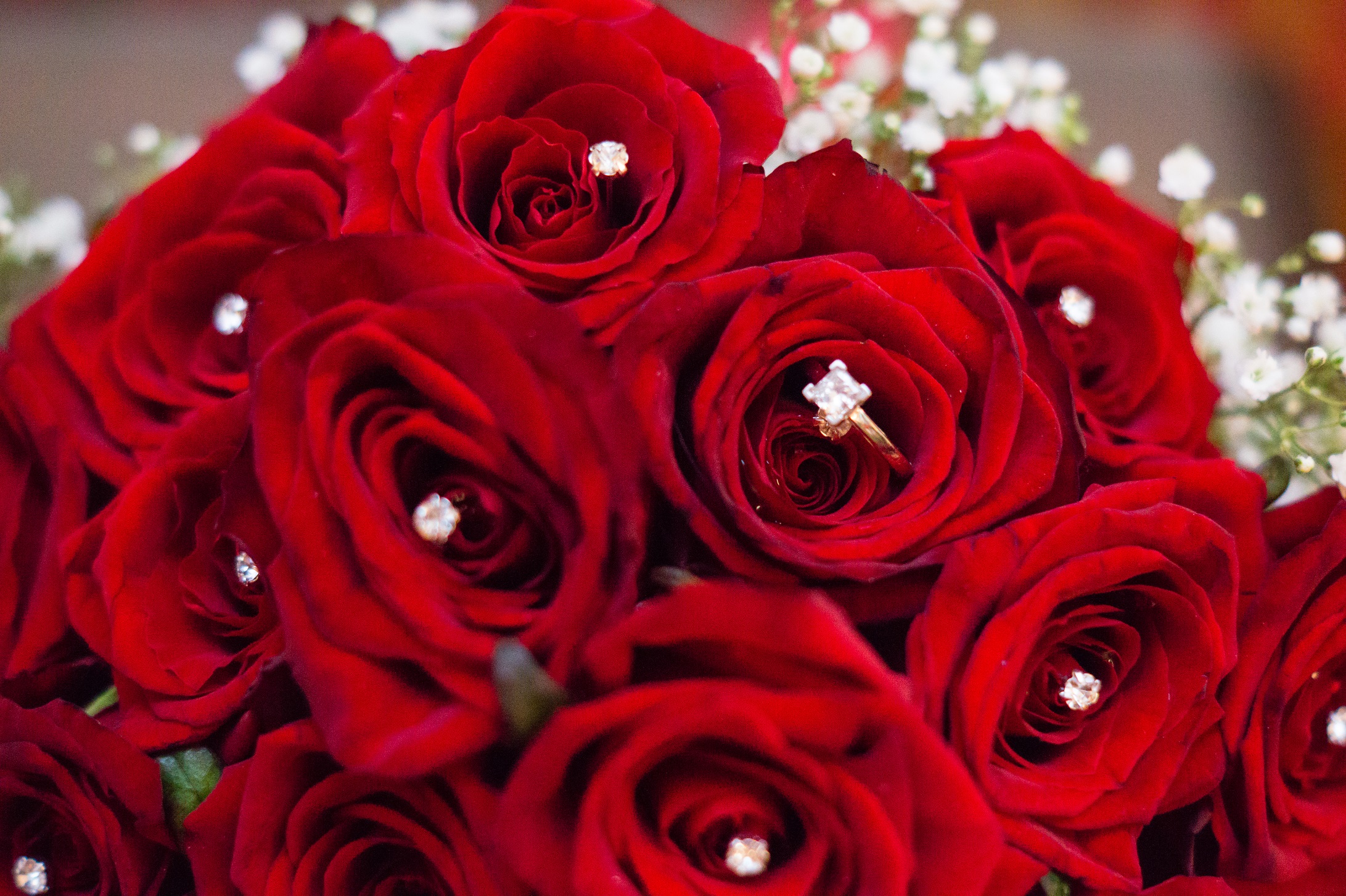 Hanbury Manor Wedding, Hertfordshire, red rose wedding flowers, diamond ring