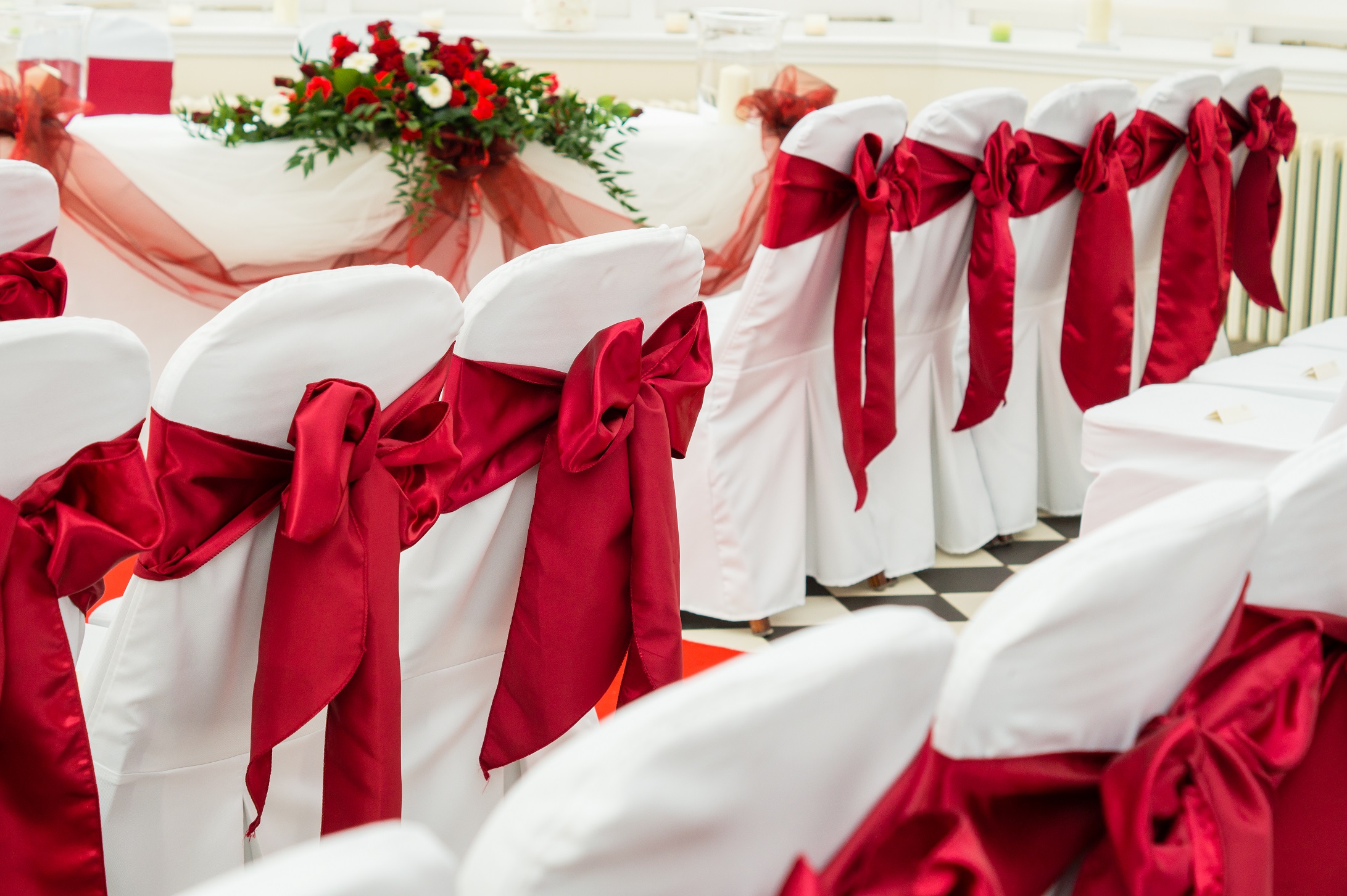 Hanbury Manor Wedding, Hertfordshire, red chair tie ceremony details