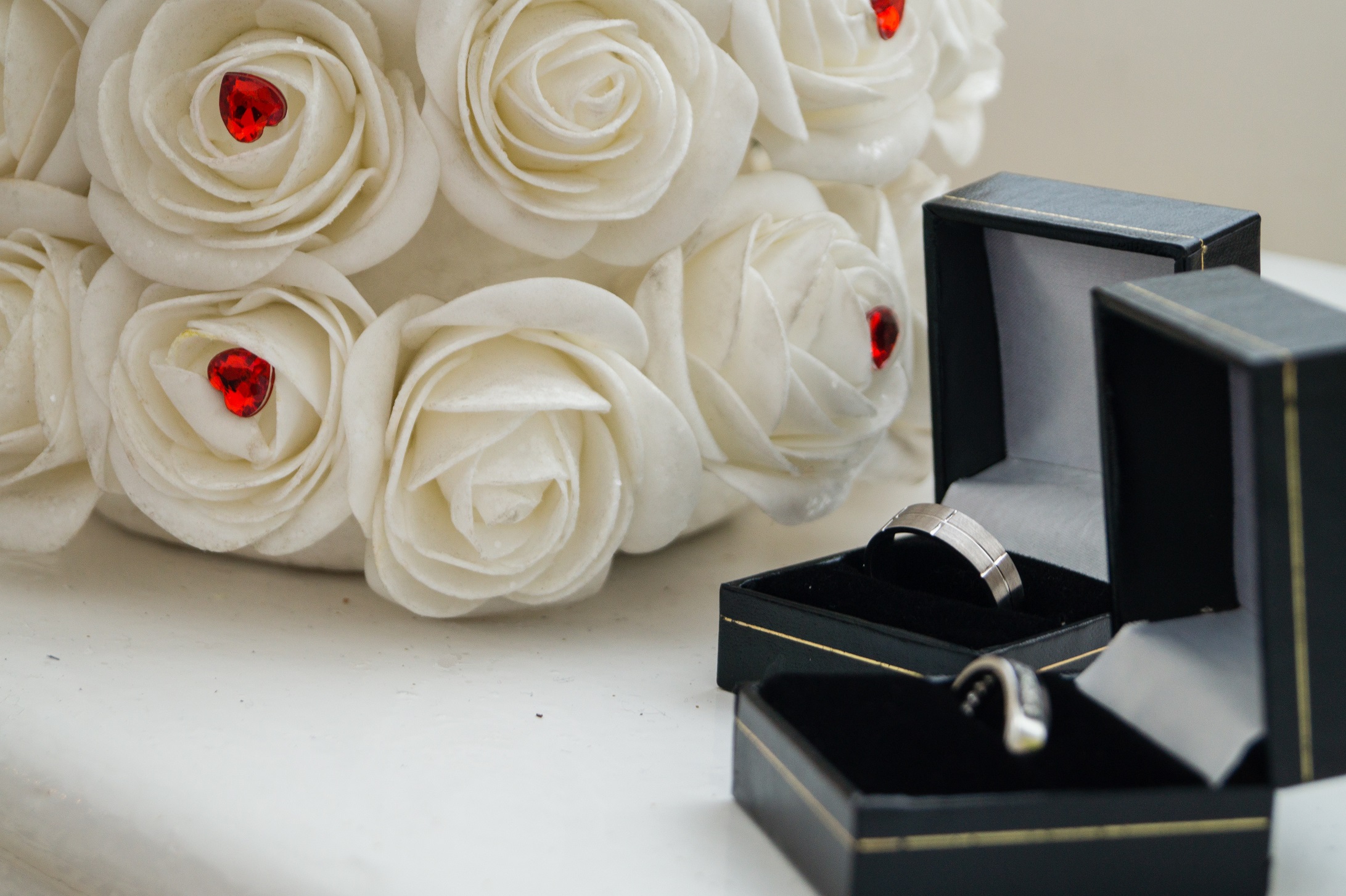 Hanbury Manor Wedding, Hertfordshire, wedding rings, white roses, red heart details, ring boxes
