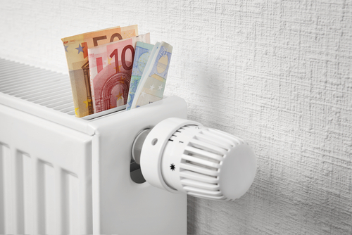 image of radiator with euro notes sticking out of the top