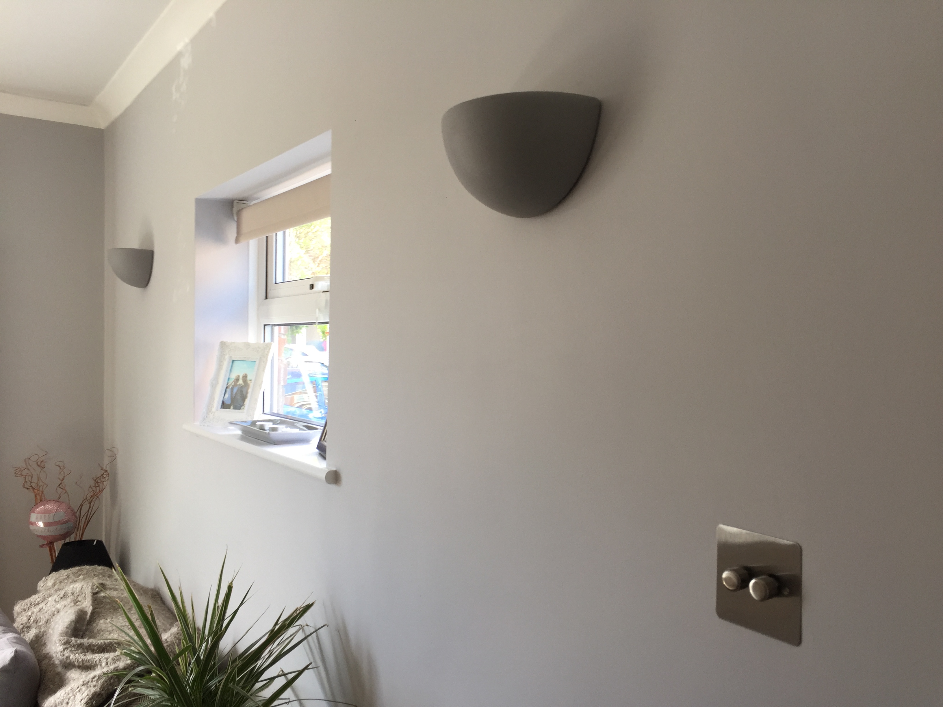 Newly installed wall uplighters with LED lamps and compatible 2 gang dimmer switch