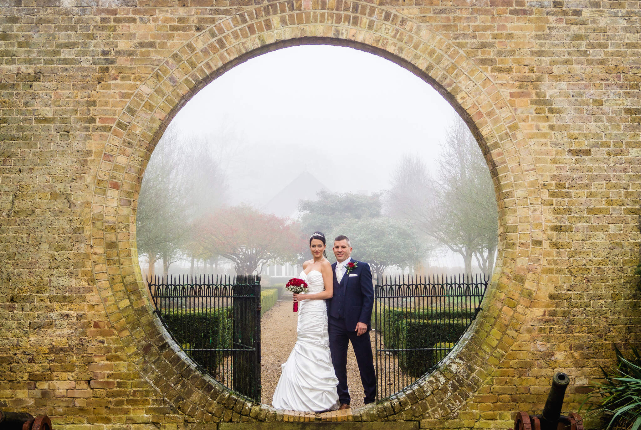 Hanbury Manor Wedding, Hertfordshire, bride and groom statement impact portrait