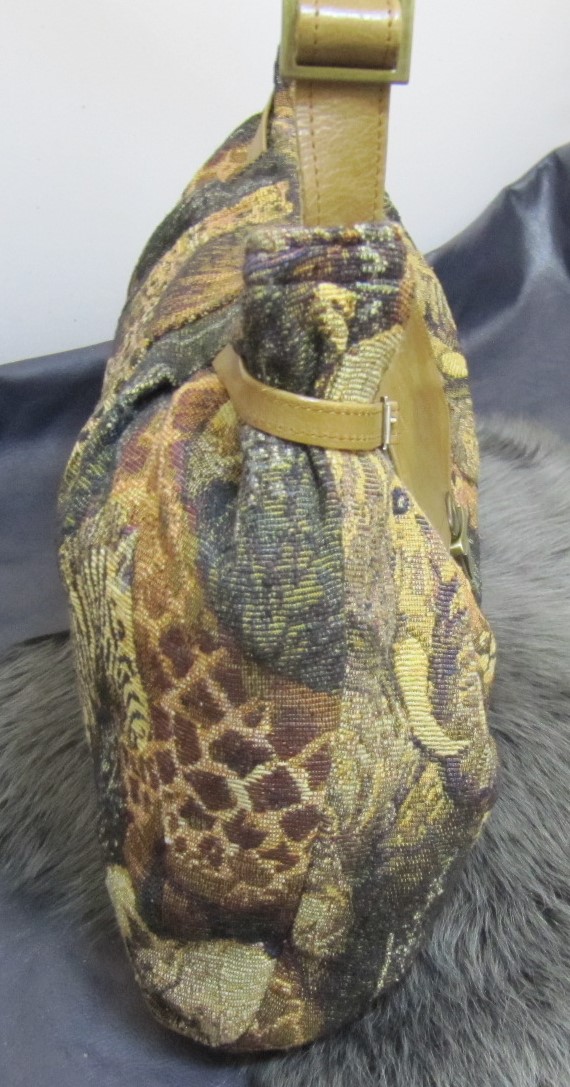 Wildlife fabric and tan leather handbag