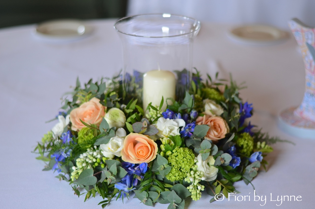 wreath,peach-roses,blue-delphinium,white,mint-spring-flowers,stormLantern,candle.jpg