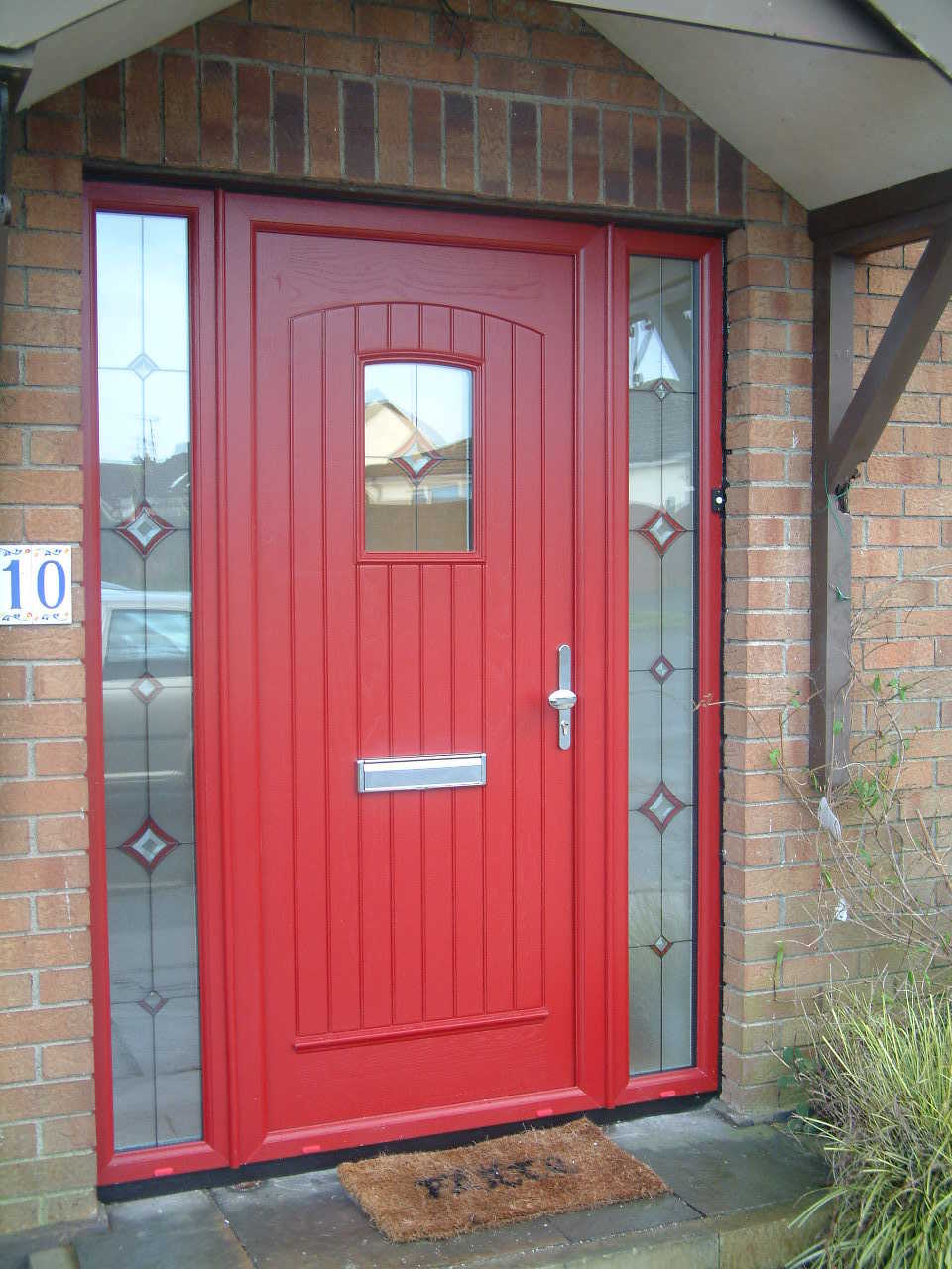 RED PALLADIO T & G COMPOSITE FRONT DOOR FITTED IN DELGANY.