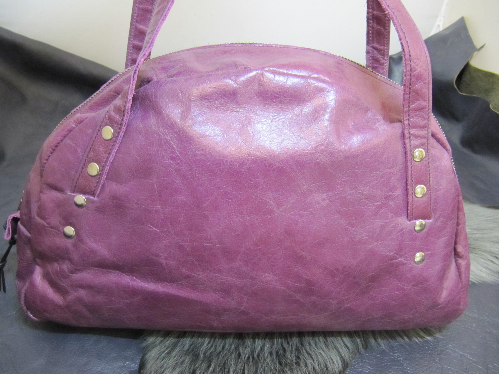 Purple leather half moon handbag