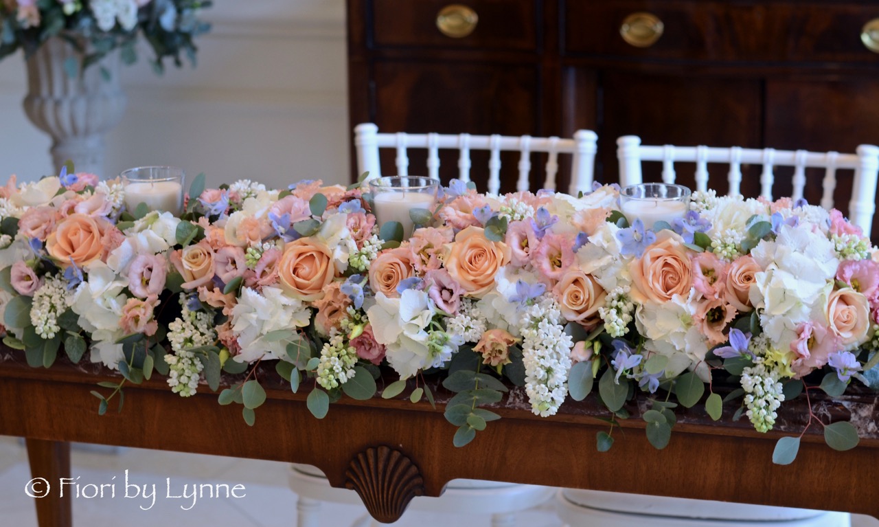 ceremony-table-flowers-wedding-long-low-peach-blue-white.jpg