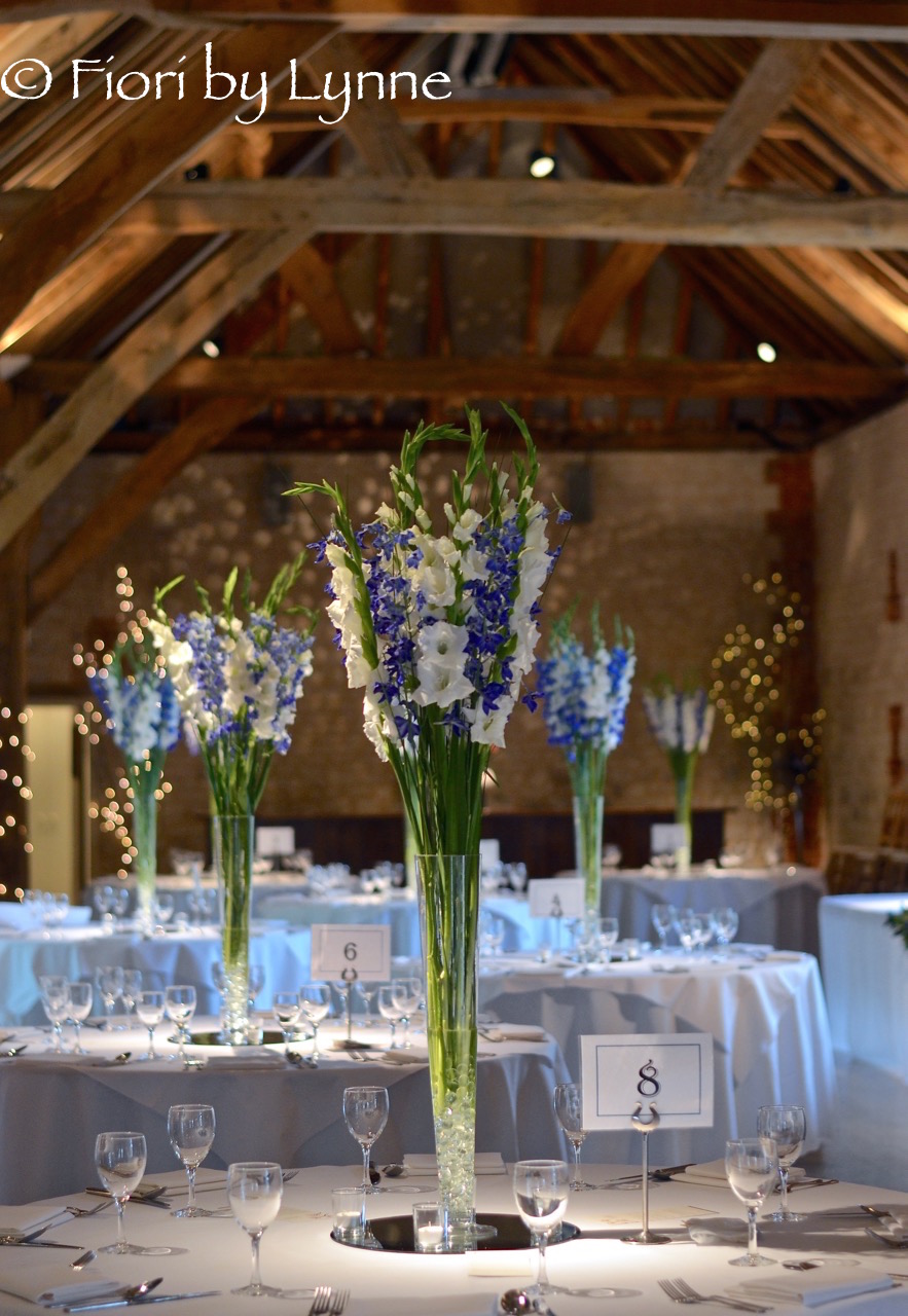 barn-bury-court-tall-centrepiece-blue-delphiniums-white-gladioli1.jpg