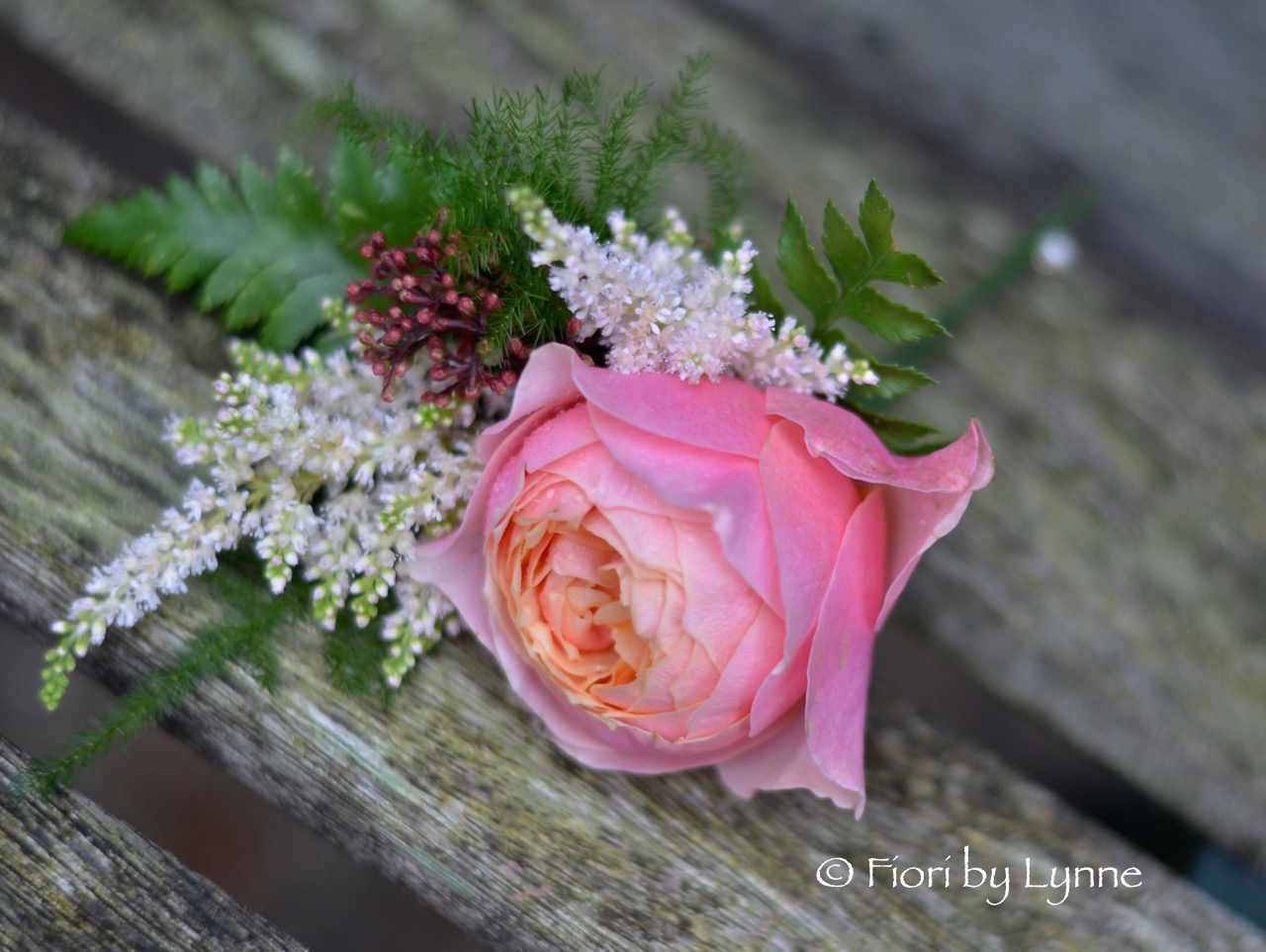 buttonhole-coral-rose-fern-skimmia-astilbe.jpg