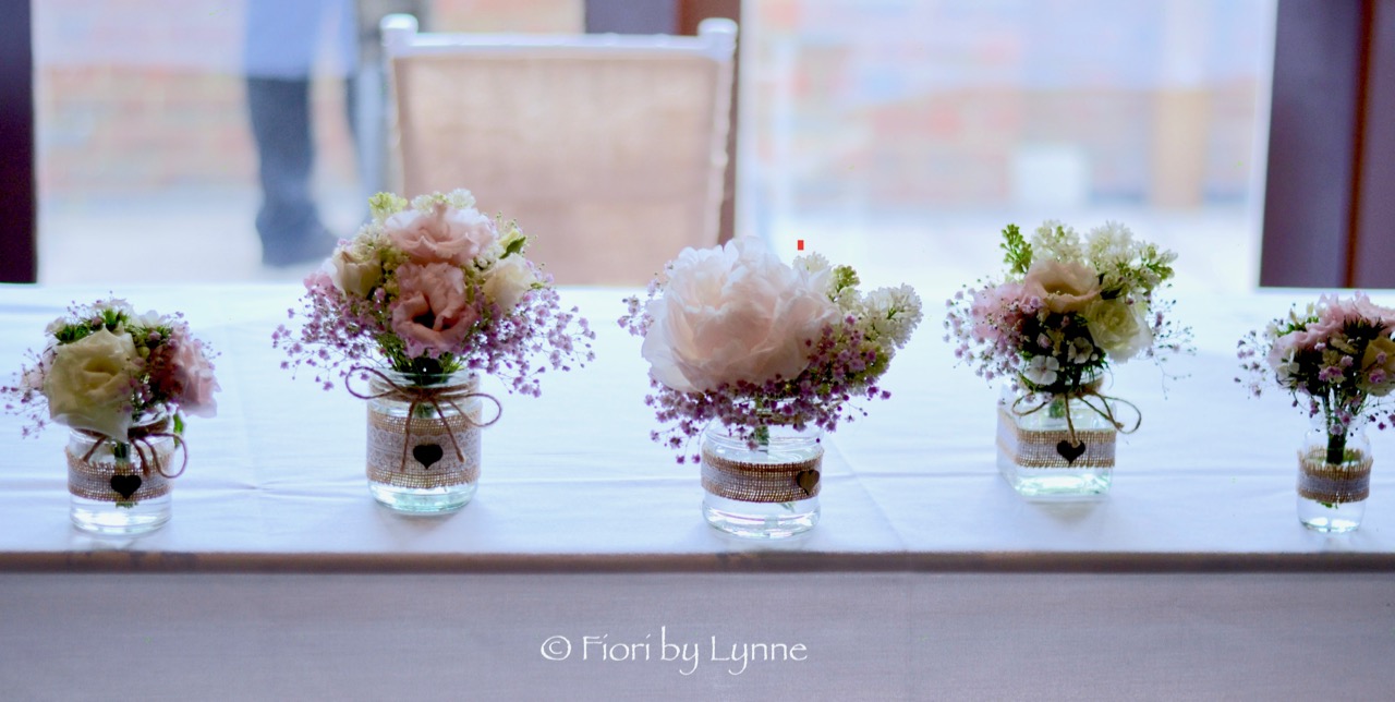 ceremony-table-mixed-jarsbottles-springflowers.jpg
