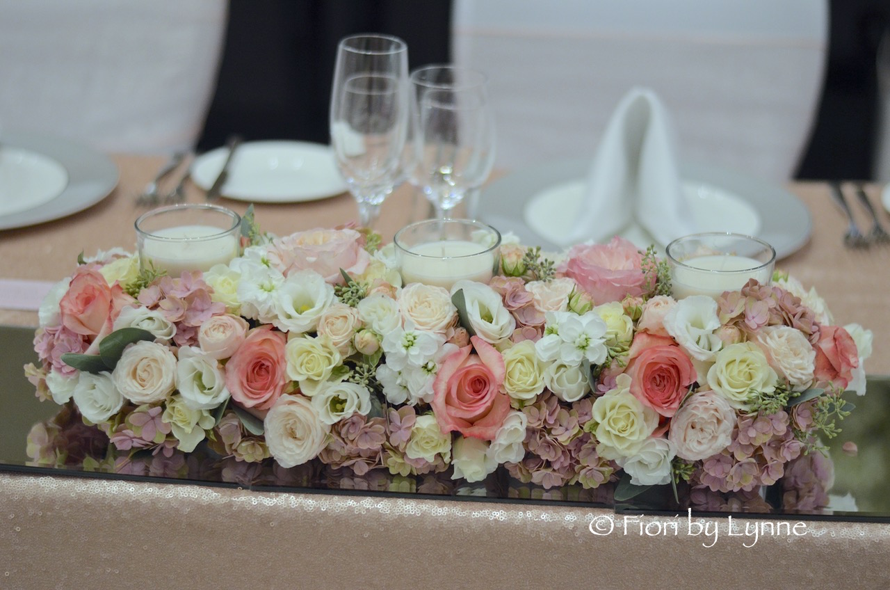 elegant-top-table-flowers-with-buried-scented-candles1.jpg