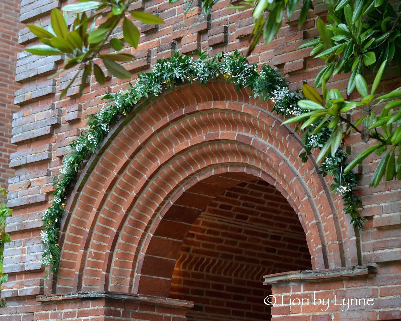 floral-arch-foliage-fairylightsgypnewplace.jpg