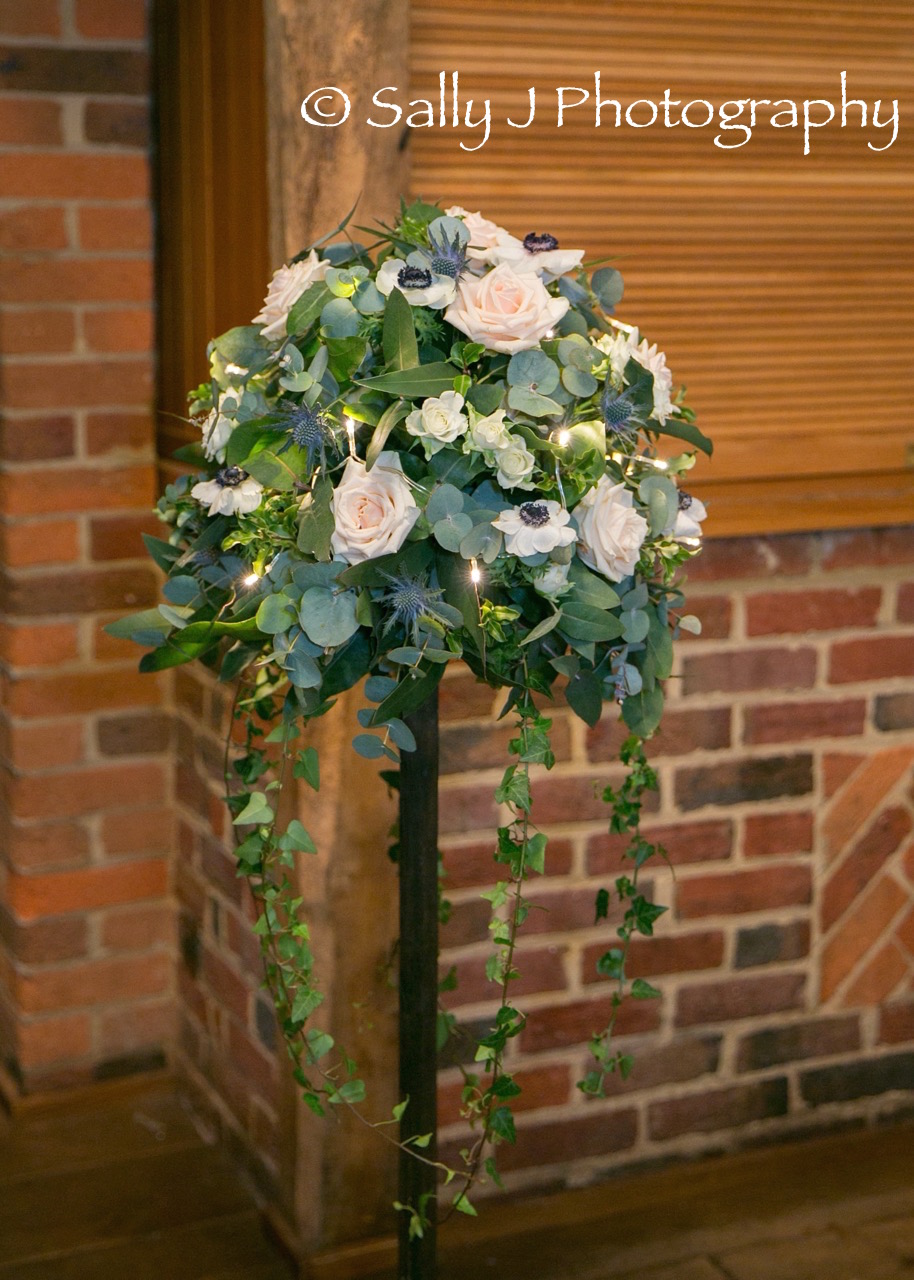 lainstonhouse-rustic-floral-stand-fairy-lights.jpg