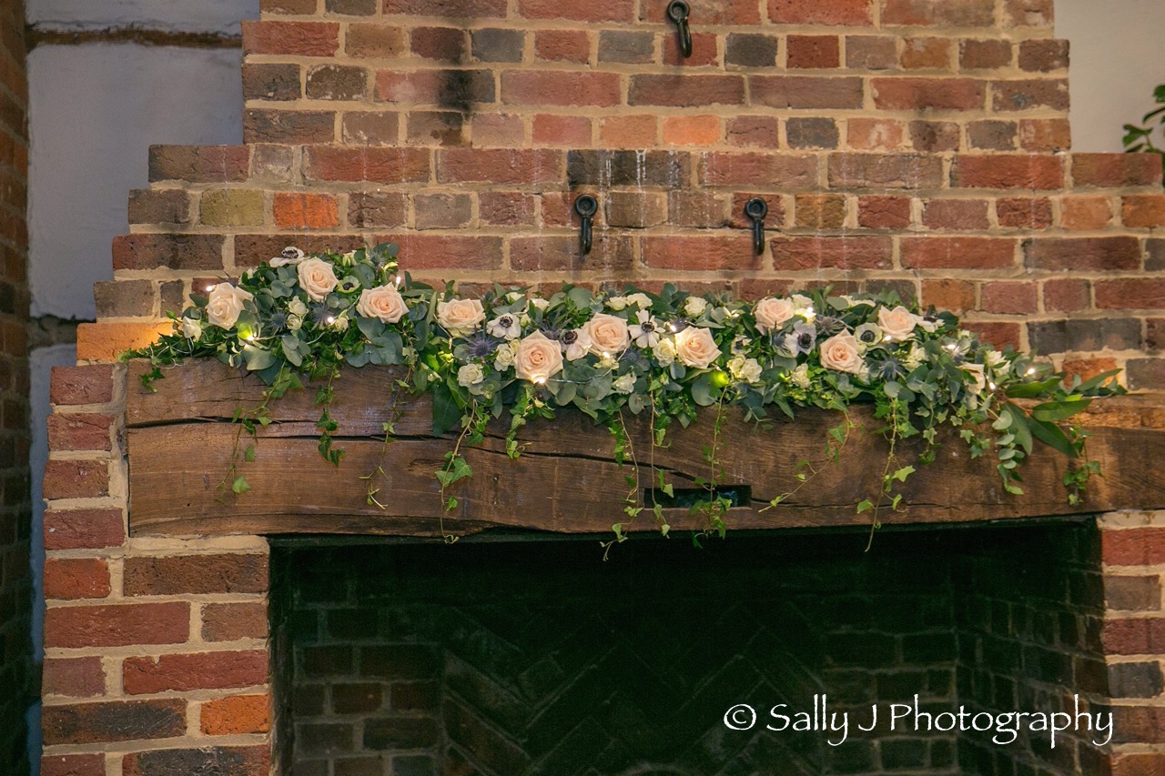 lainstonhouse-wedding-flowers-mantle-barn-rosethistle-lights.jpg