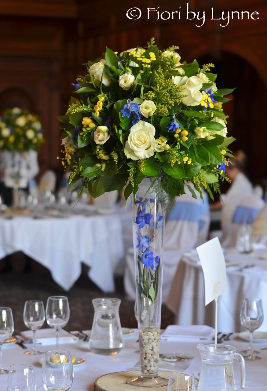 rhinefieldhouse-spring-wedding-yellow-blue-tall-centrepieces.jpg