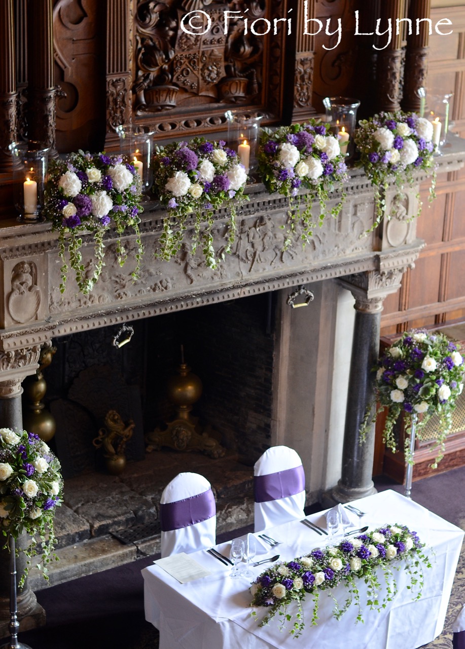 rhinefieldhouse-wedding-tablemantle-flowers-purple-white.jpg