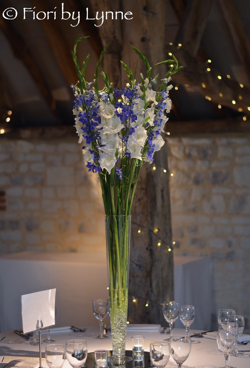 tall-simple-centrepiece-blue-delphiniumswhitegladioli-barn-burycourt.jpg
