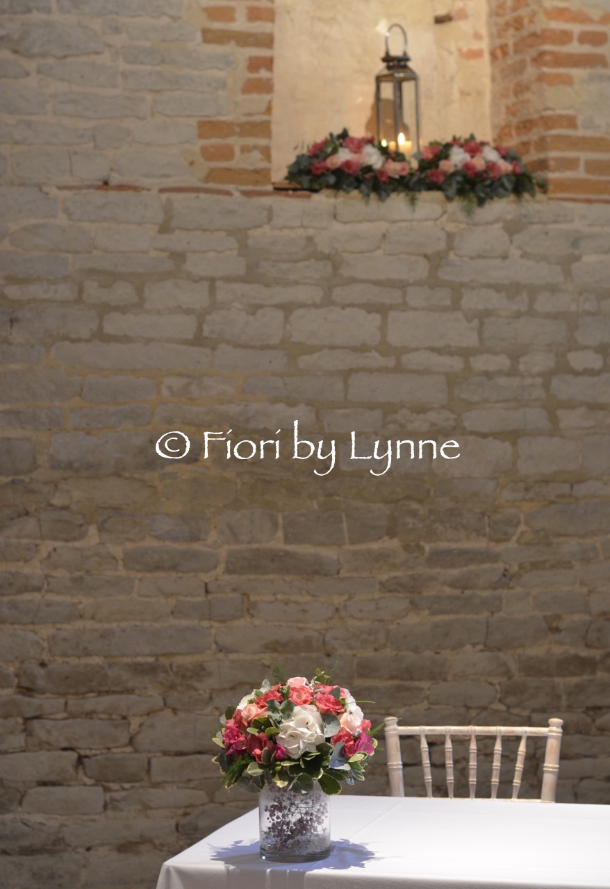 tithe-barn-petersfield-ceremony-flowers-ledge-archtable.jpg