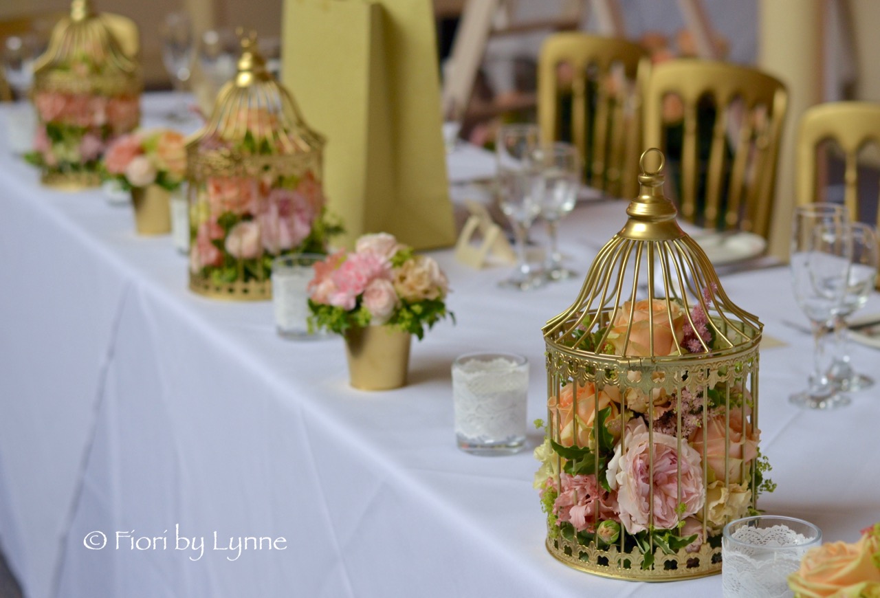 top-table-birdcages-pots-flowers-gold-peach-pink.jpg