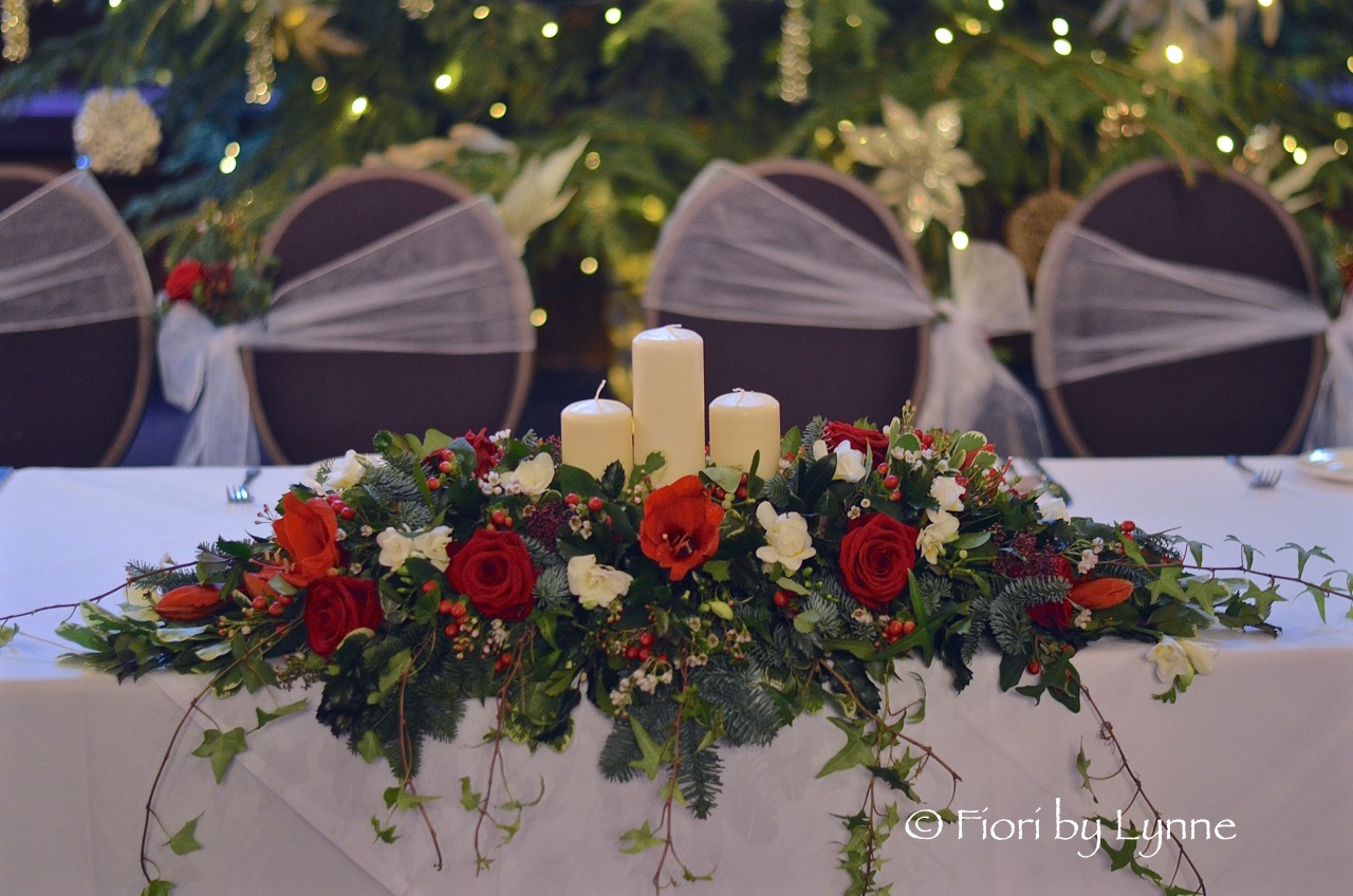 traditional-christmas-top-table-flowers-candles.jpg