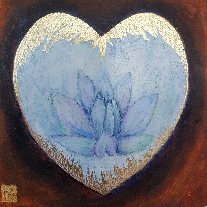 A pale lotus flower within a heart shape with gold leaf design