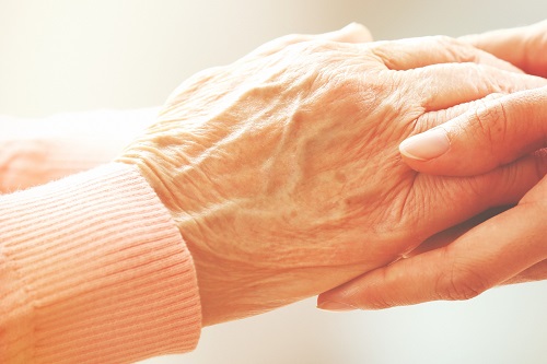 older person's hands being clasped, towels ideal for elderly people and elderly care