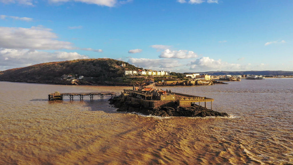 Aerial sequence depicting Birnbeck Pier at Weston-super-Mare, built in 1867 and currently derelict.