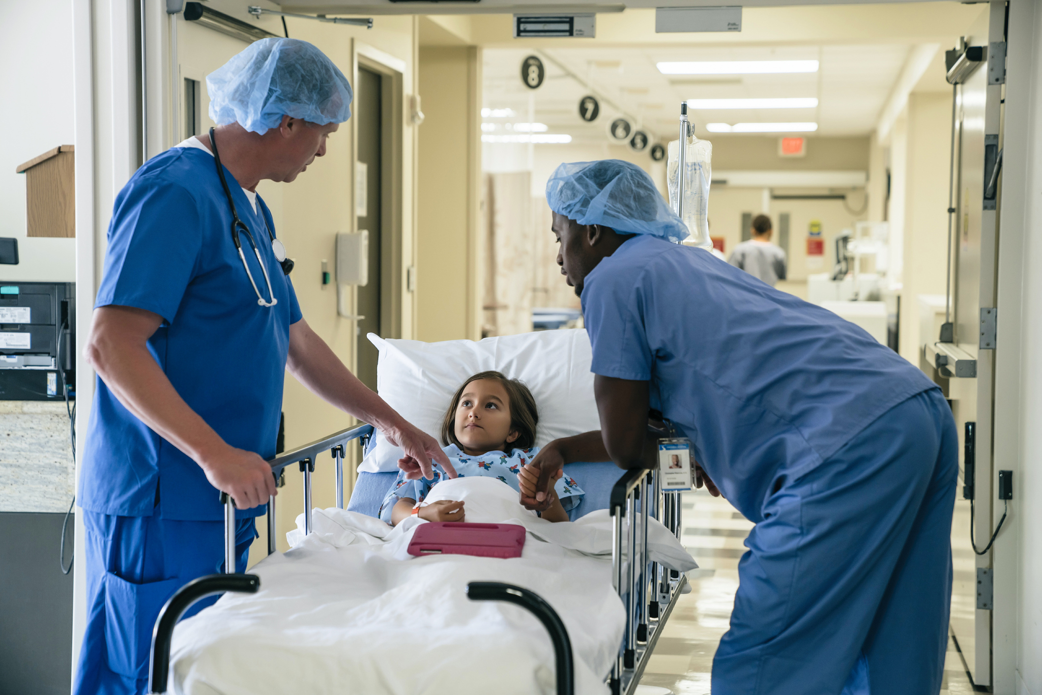 nurses-talking-to-girl-in-hospital-gurneyjpg