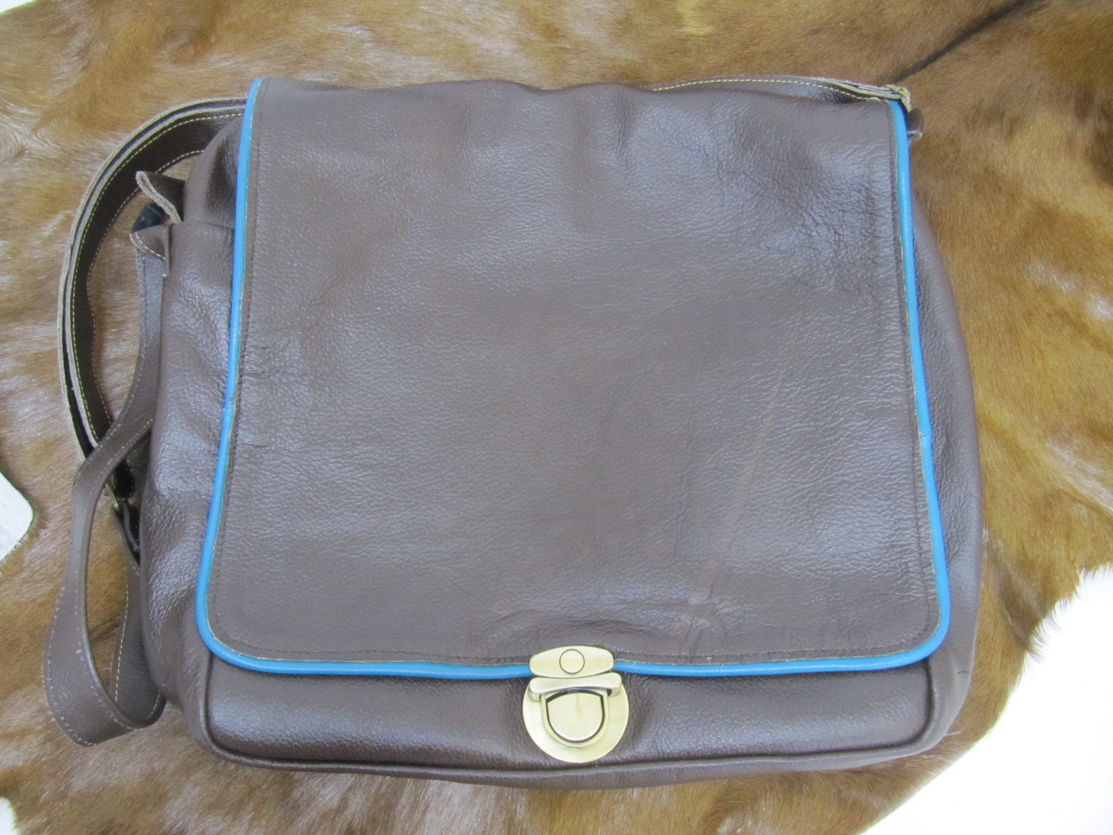 Large brown leather handbag with colourful piping