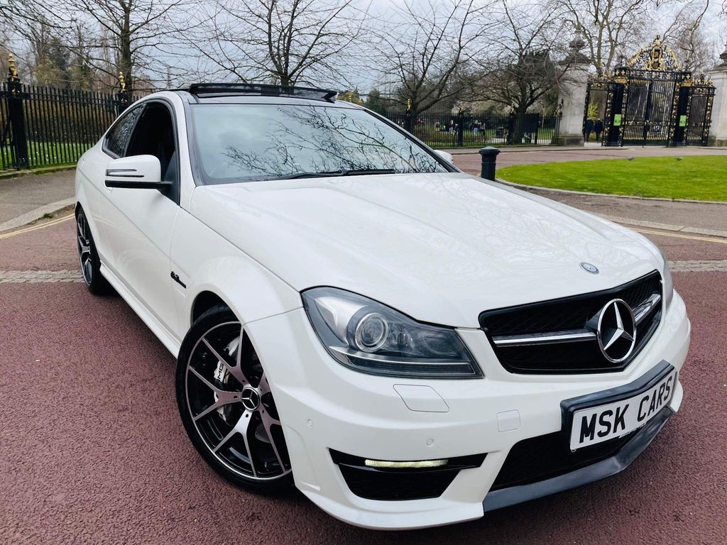 Presented in the factory Pearl White with a Full Black AMG Leather interior