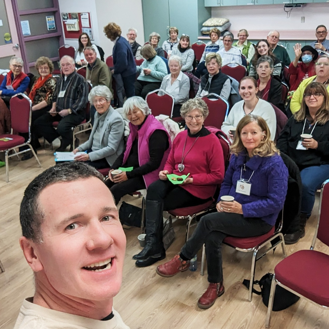 Farmer Glen Young giving a presentation to a group of community members