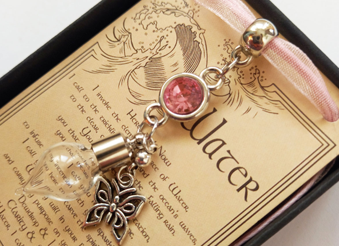 Pink Butterfly - Charmed Pendant filled with St.Brigid Well Water from an Irish Holy Well.