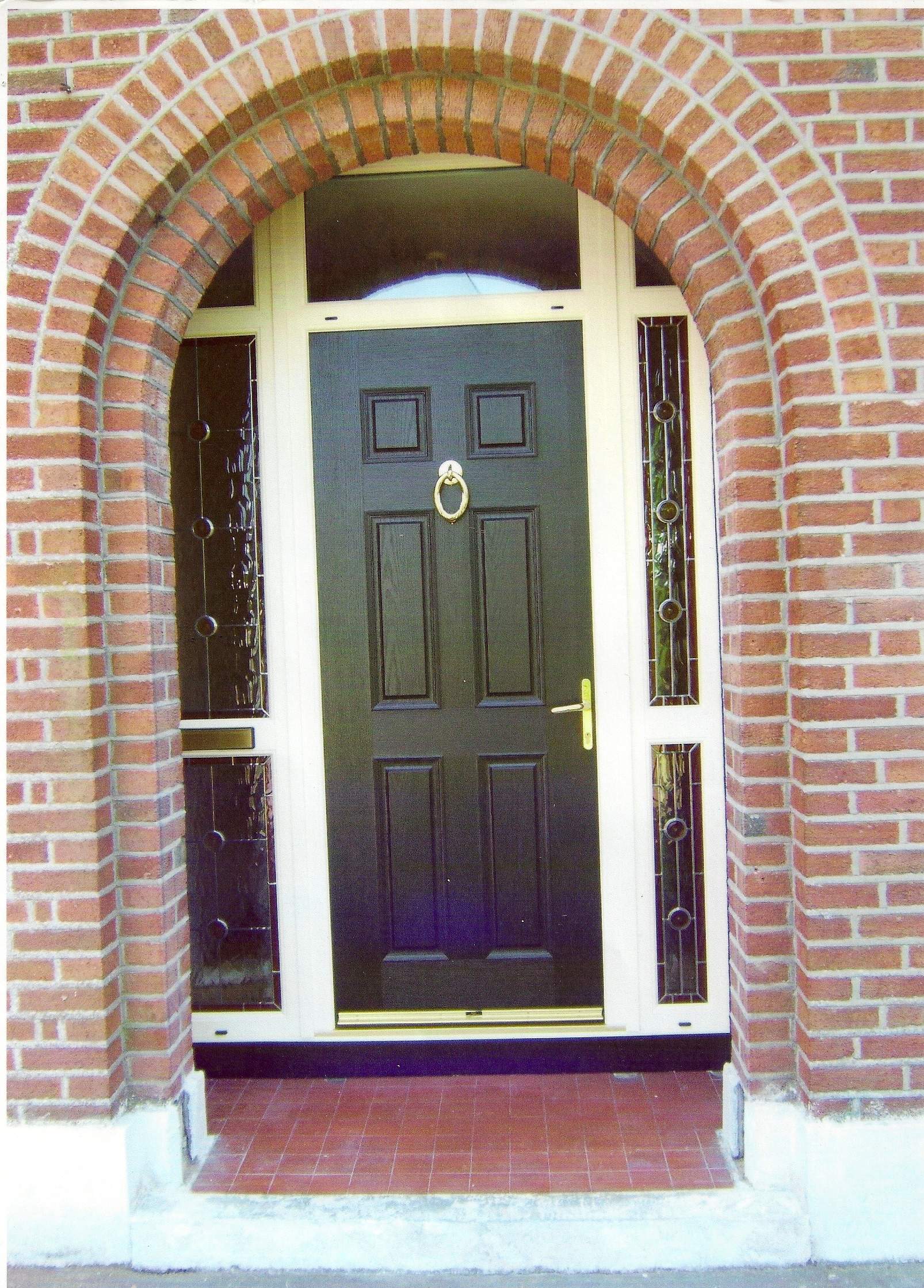 BLACK APEER COMPOSITE DOOR WITH CREAM FRAME FITTED BY ASGARD WINDOWS IN DUBLIN 20.