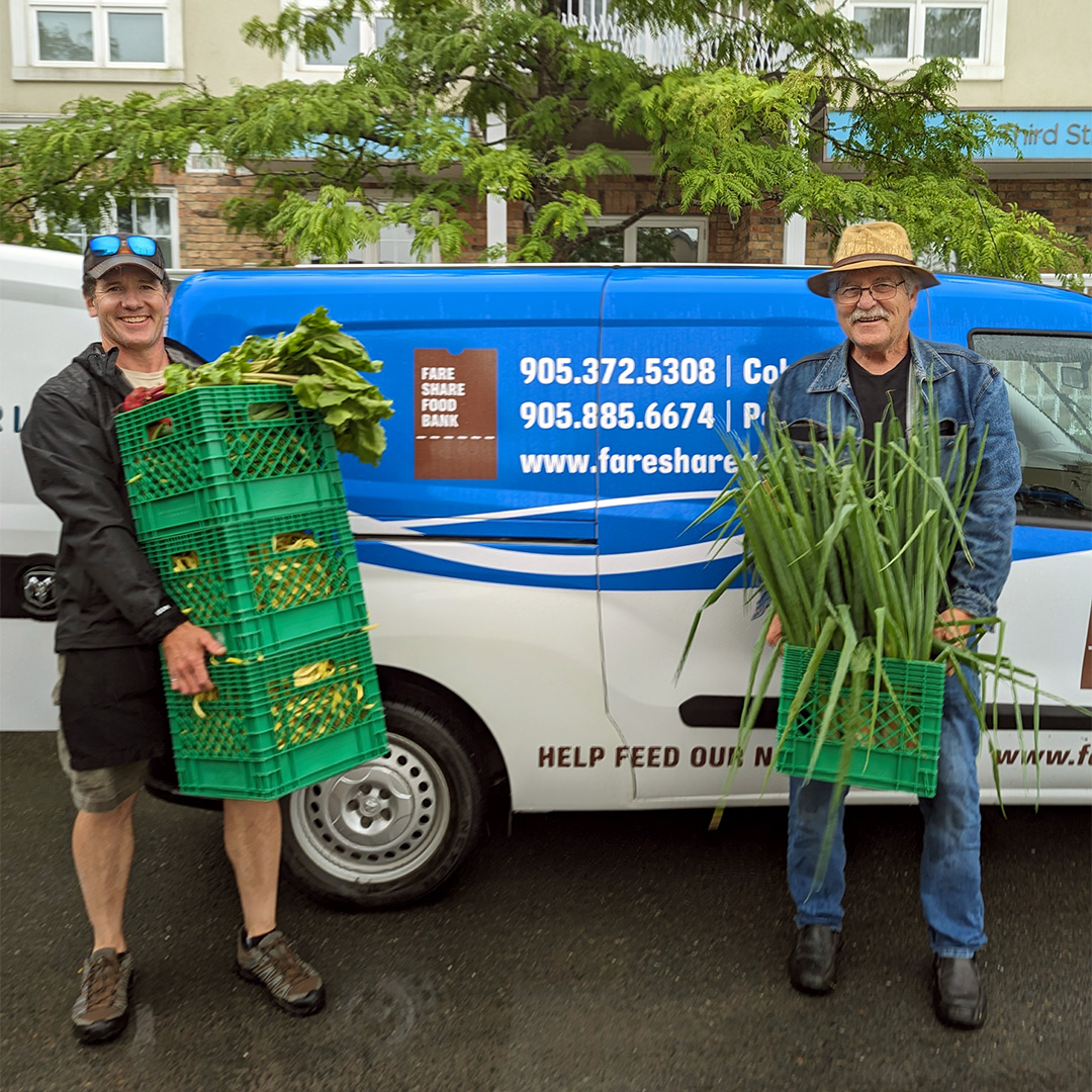 Farmer Glen Young donating crates of organic food to the Northumberland Fare Share Food Bank