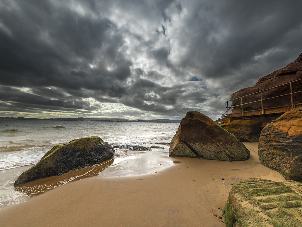 High tide at Rodney steps provide a safe haven from the gathering storm. Stock Image ID: 2151