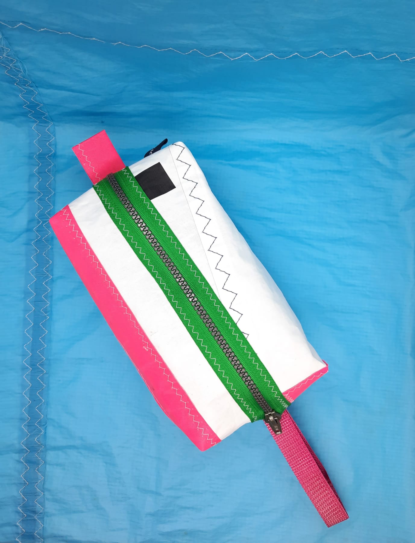 Wash Bag with pink stripes and a green zip